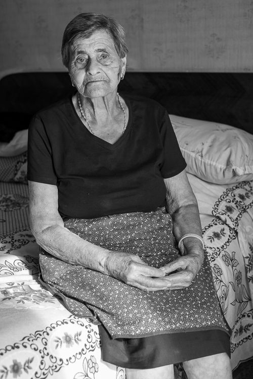 Portrait of Assunta Colonna in Muro Lucano, reflecting on her deep family traditions and connection to her community.